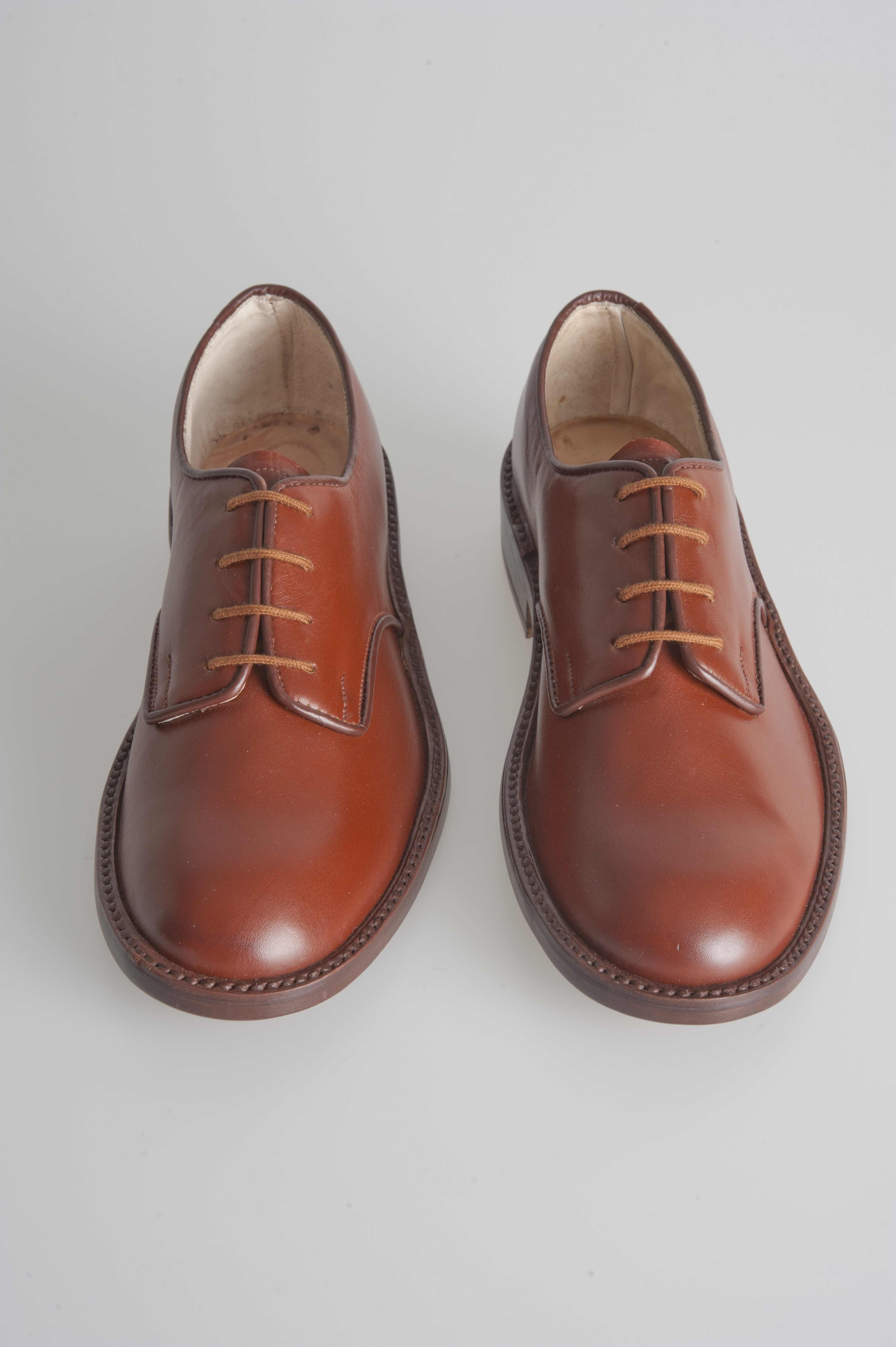Sculpture.A pair of two left brown leather shoes, size eu 36.